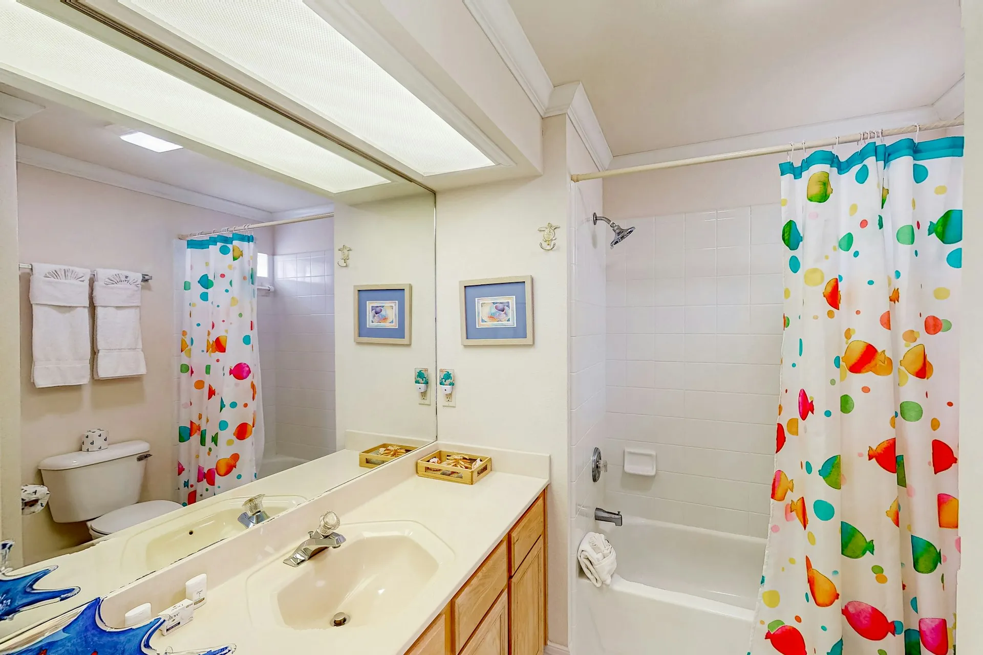 Bathroom with tub, shower, and vanity