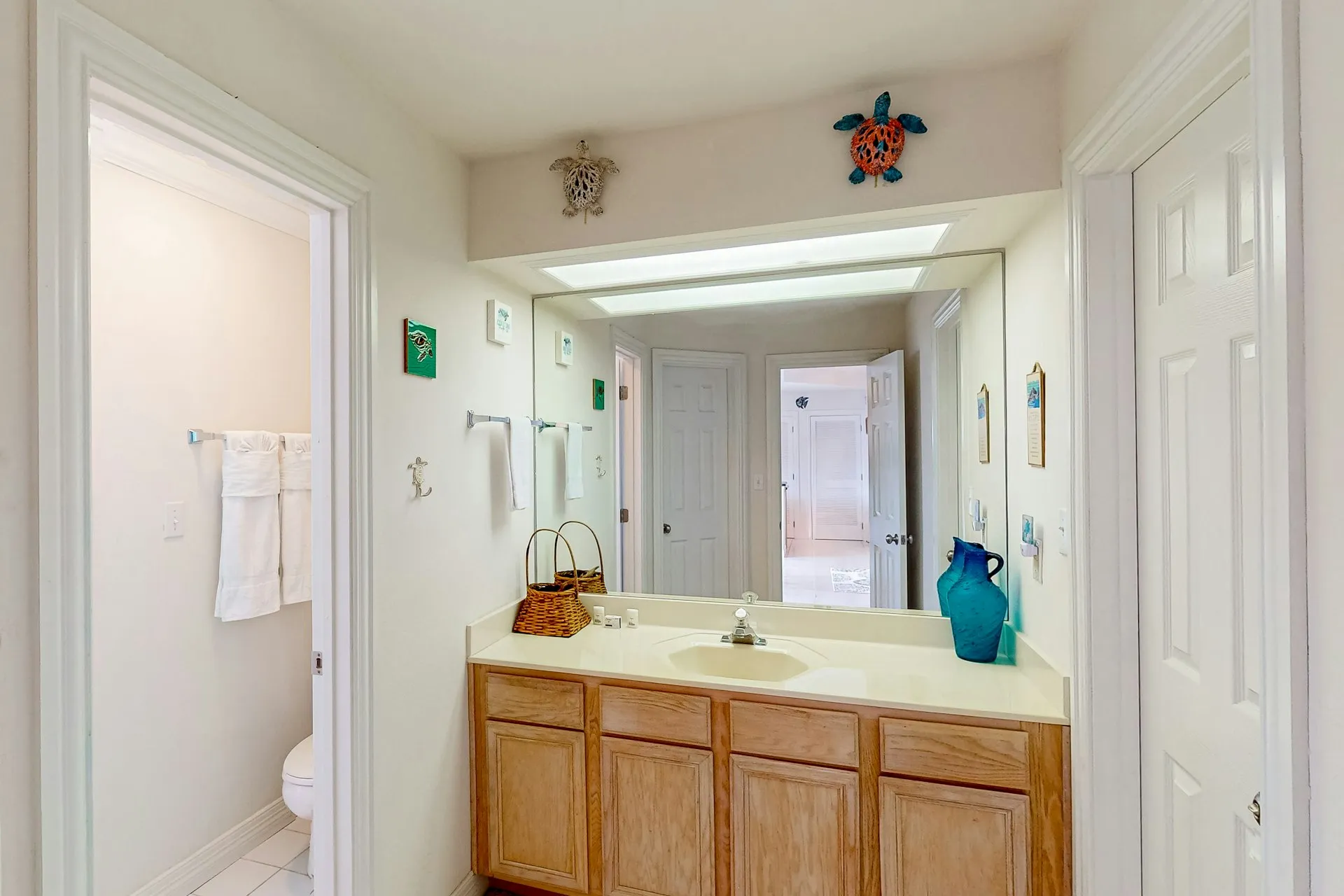 Bathroom vanity with turtle wall decor