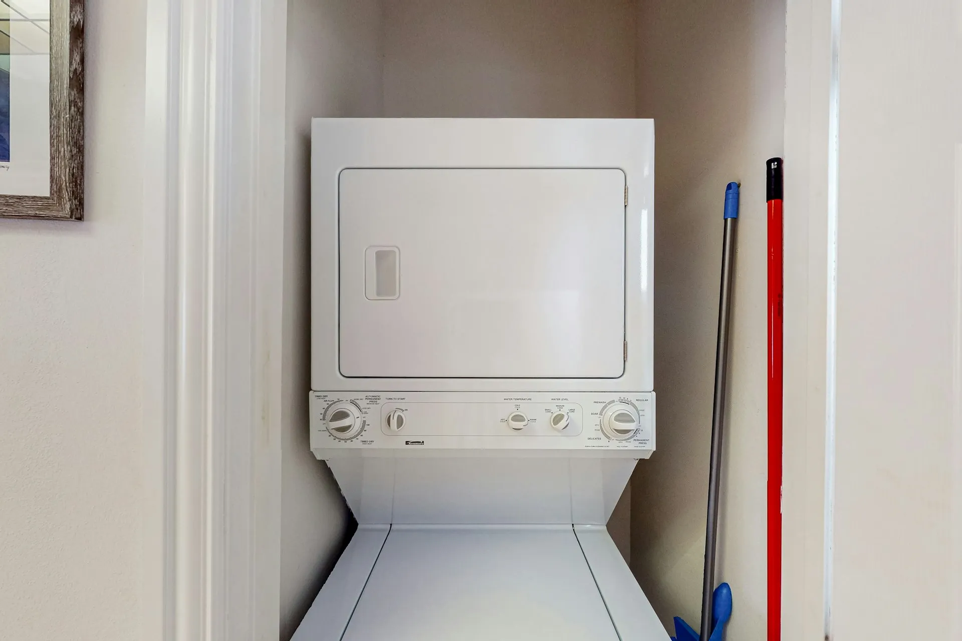 In-unit stacked washer and dryer