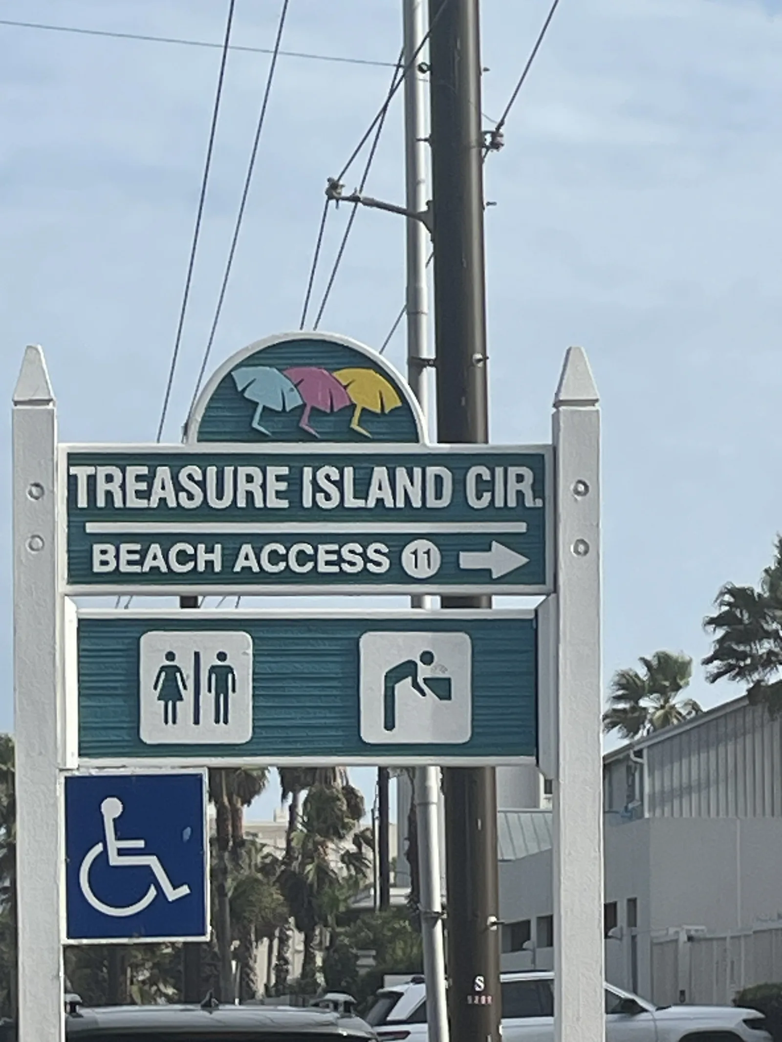 Treasure Island Circle Beach Access 11 sign with restroom and water fountain icons